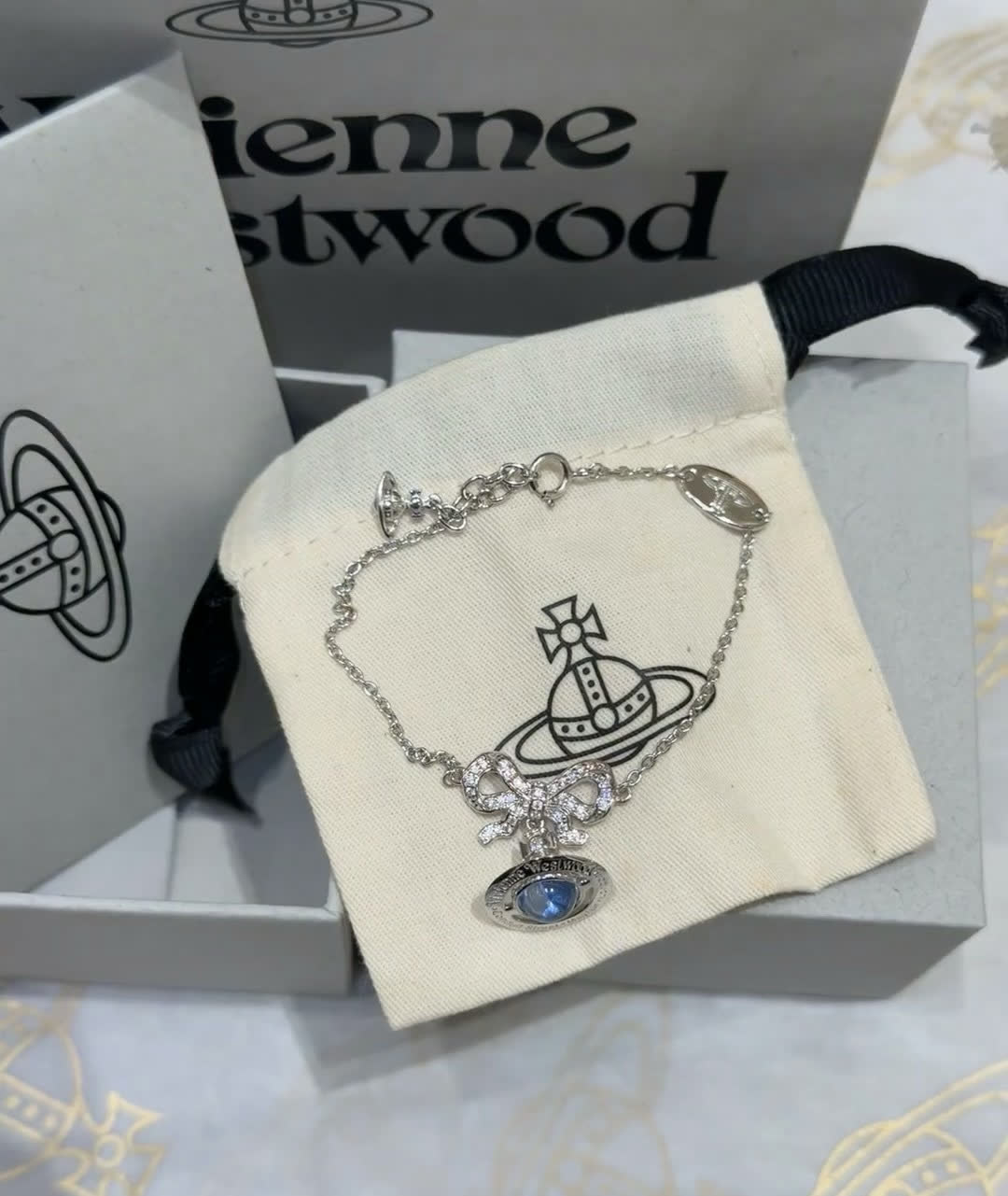 Vivienne Westwood Silver Bracelet with Blue Stone and Bow